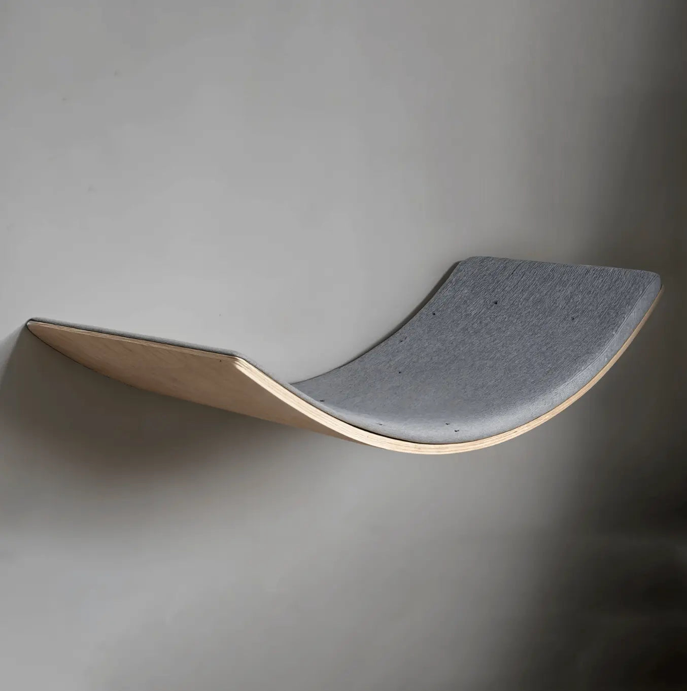 Loya Light Pet Cat Lounger LOYA LIGHT Pet Lounge, where modern design meets unparalleled comfort. Crafted from high-quality plywood, this pet lounge offers a warm, minimalist aesthetic that seamlessly integrates into any living space. Its ergonomic shape