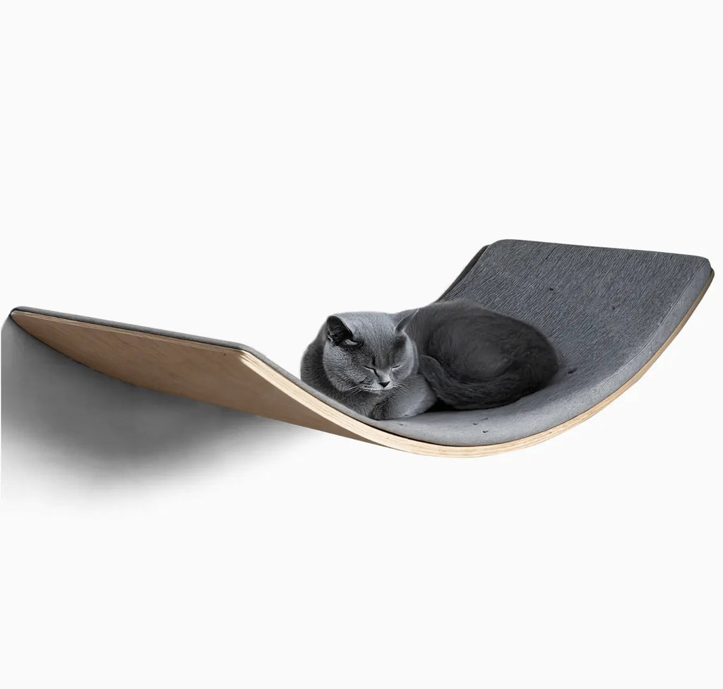 Loya Light Pet Cat Lounger LOYA LIGHT Pet Lounge, where modern design meets unparalleled comfort. Crafted from high-quality plywood, this pet lounge offers a warm, minimalist aesthetic that seamlessly integrates into any living space. Its ergonomic shape