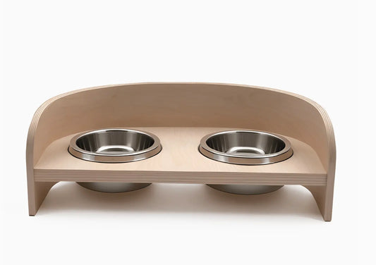 Modern Wooden Pet Bowl Stand with Stainless Steel Bowls Crafted with natural plywood, this modern feeding station brings the warmth of wood into your home while maintaining a sleek, contemporary aesthetic that seamlessly integrates with your décor. Key Fe
